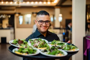 Server-with-Tray-of-Salads